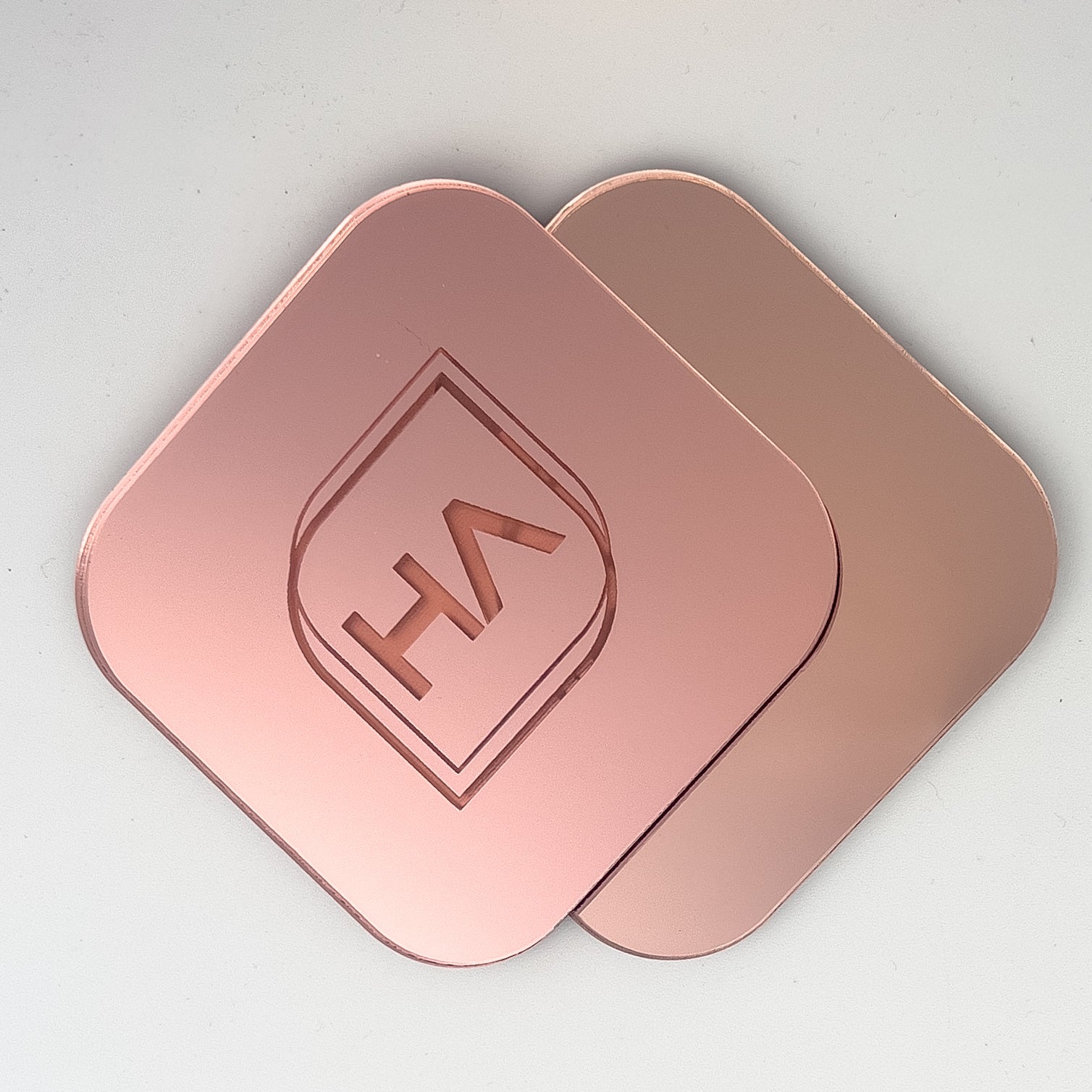 Houston Acrylic's Blush Pink Mirror on top of the Rose Gold Mirror for comparison.